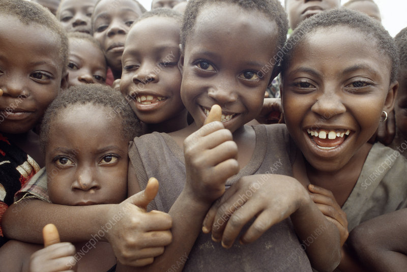 Crowd of smiling African children. Photographed in Daboese, Ghana.